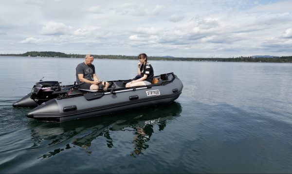 fishing on a lake in British Columbia Canada in an inflatable boat