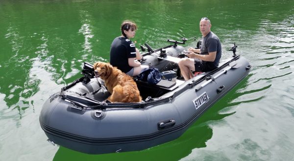 fishing on a lake in British Columbia Canada in an inflatable boat