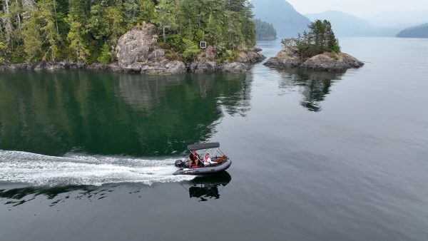 inflatable boat with bimini sunshade exploring the waters of British Columbia Canada