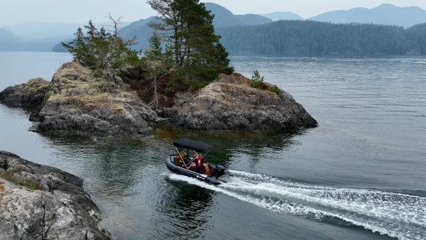 inflatable boat with bimini sunshade exploring the waters of British Columbia Canada