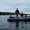 couple and dog fishing on a lake in beautiful British Columbia