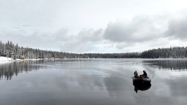 grey inflatable boat with EVA foam on aluminum floor in the lake with man woman and dog