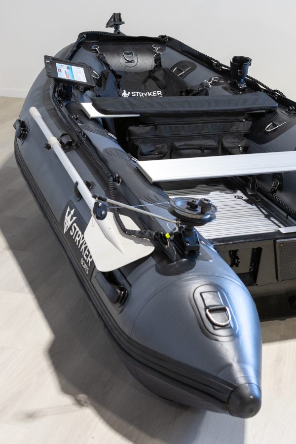 grey inflatable boat in showroom with new Stryker Logo 2024