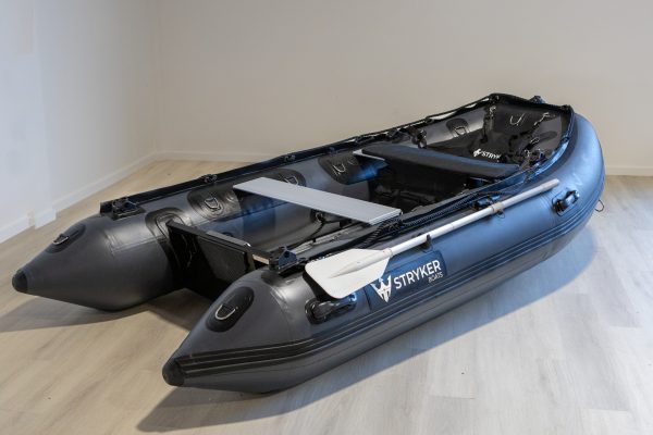 grey inflatable boat in showroom with new Stryker Logo 2024