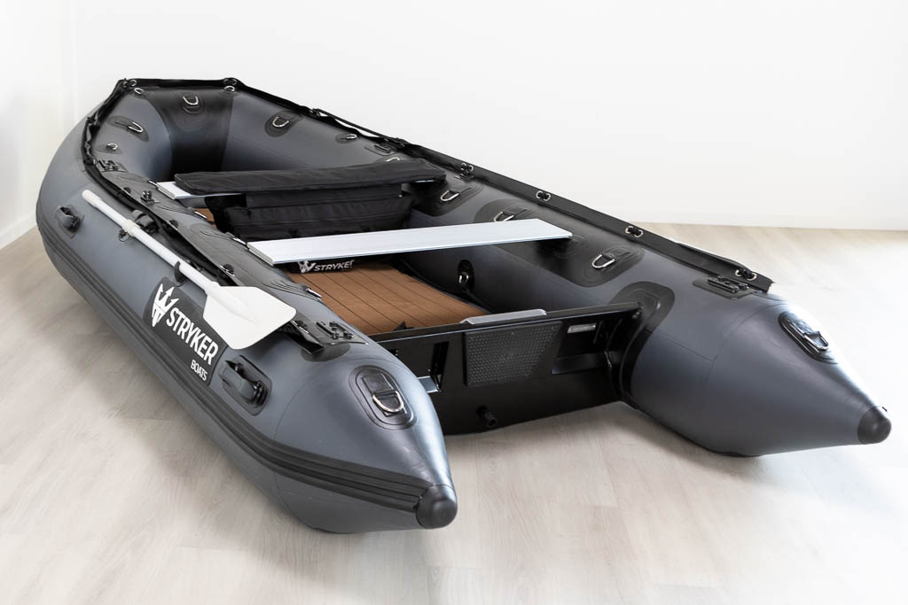 view inside of dark grey inflatable boat with high pressure airmat floor covered in Tan EVA foam.