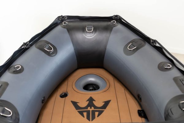 view inside of bow area dark grey inflatable boat with high pressure airmat floor covered in Tan EVA foam.