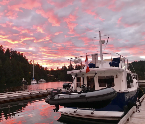 boat docked for the night with at the start of a beautiful sunset