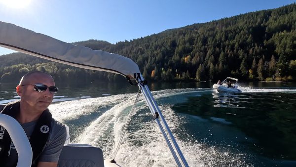 white tender yacht dinghy cruising on the water