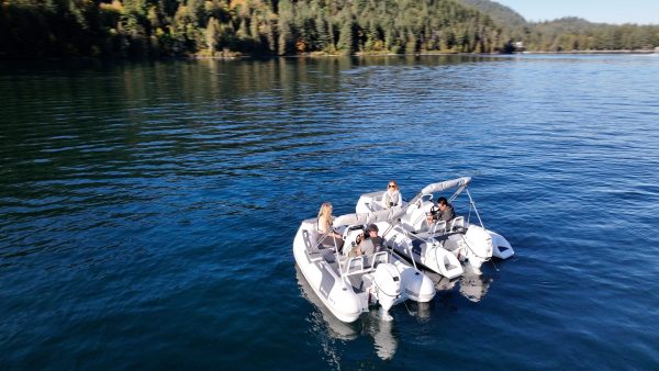 side by side white tenders yacht dinghy cruising on the water