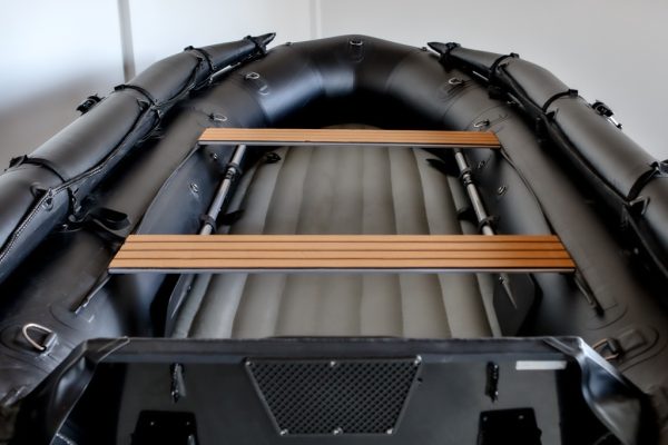 stealth black inflatable jet boat with inflatable floor in showroom