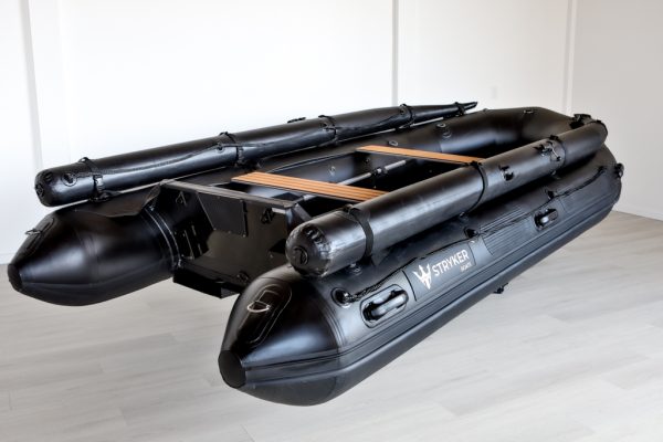 stealth black inflatable jet boat in showroom