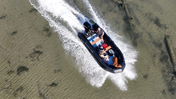 black inflatable jet boat with mercury outboard from beautiful British Columbia